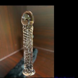 7 inch in length 1/2 inch circumference and made of glass brand new never used.